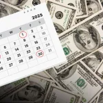 Calendar with May 1, 2, and 30 highlighted, Social Security card and cash on table.