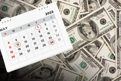 Calendar with May 1, 2, and 30 highlighted, Social Security card and cash on table.