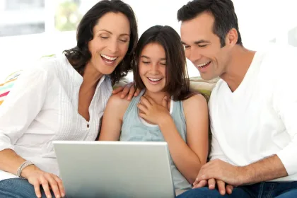 Student and parent applying for FAFSA on a laptop at home